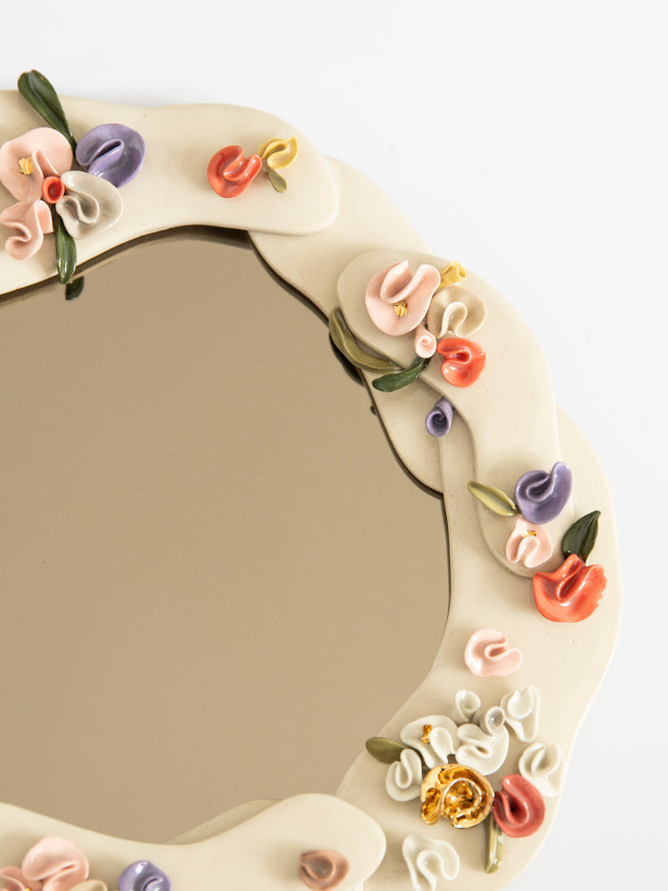 Petit miroir fleurs sculptées