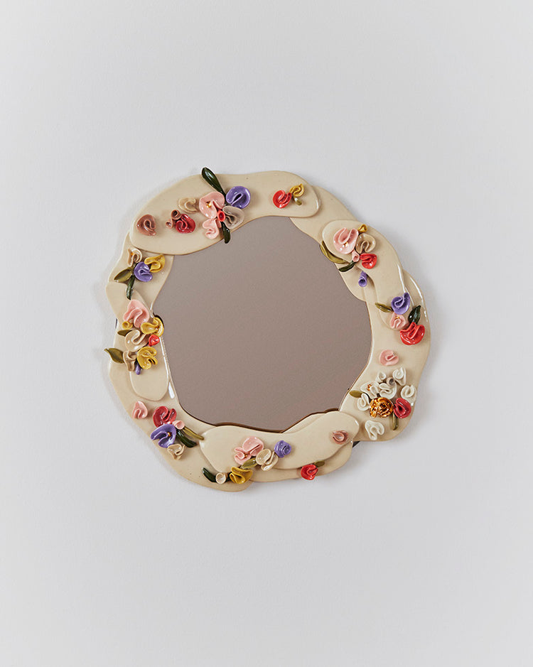 Petit miroir fleurs sculptées