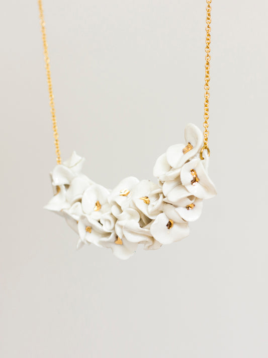 White and gold flower necklace